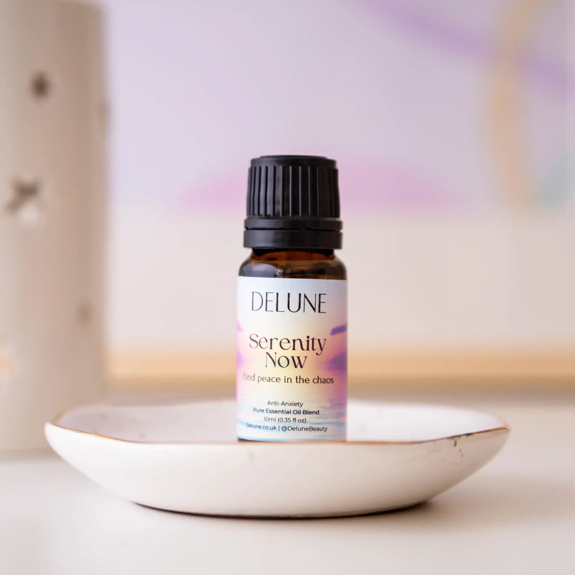 Alt Tag: Serenity Now essential oil blend bottle on a dish, promoting relaxation with lavender, chamomile, and calming fragrances.