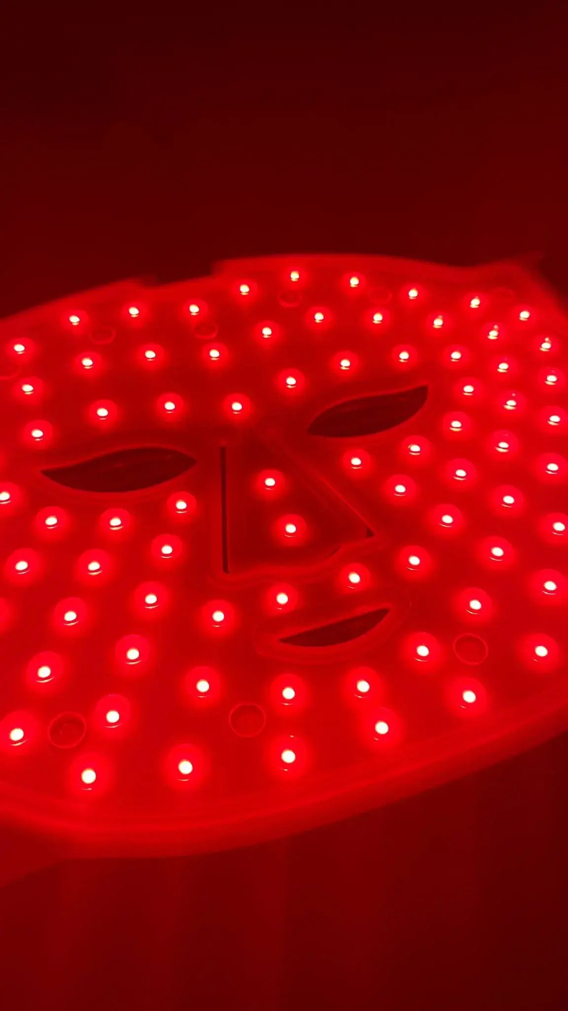 Delune Beauty's LED Facial Mask Le Professionnel with red LED light therapy for anti-aging and skin care.