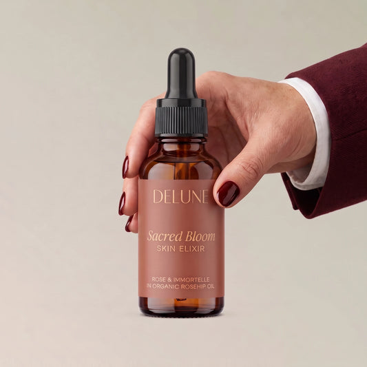 Face serum UAE – Hand holding Delune Dubai Sacred Bloom Skin Elixir