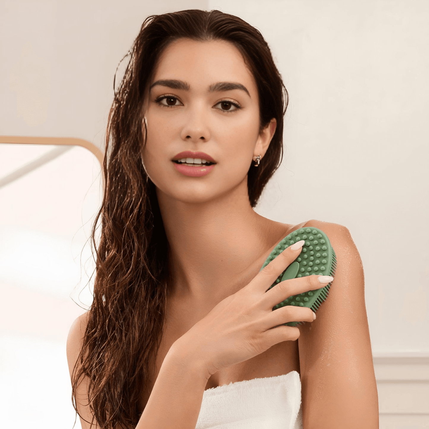 Woman using Delune Silicone Body Scrubber for gentle cleansing and massage in bathroom