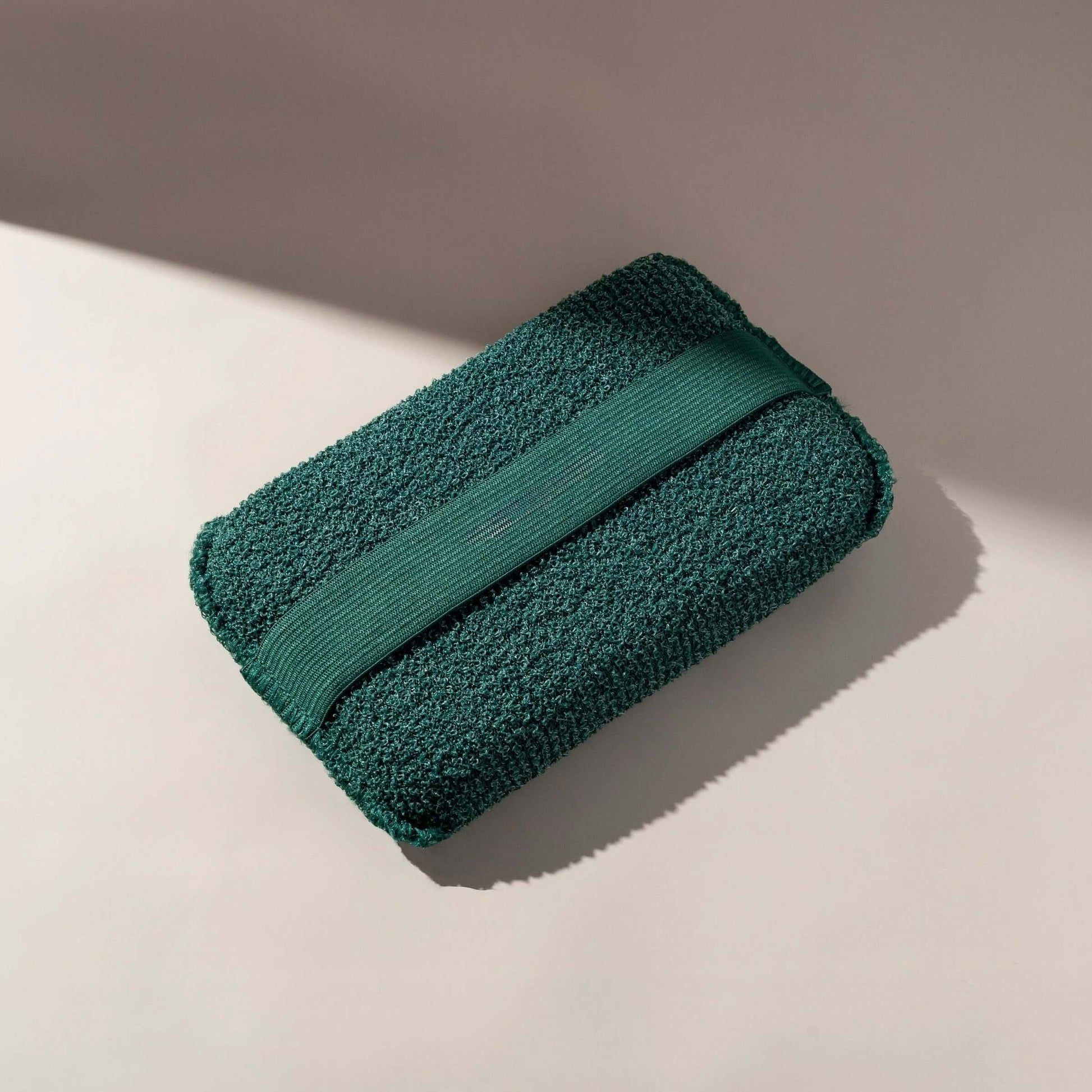 Alt Tag: XL green body buffer with strap for exfoliating and cleansing, designed for easy use in the shower or bath.