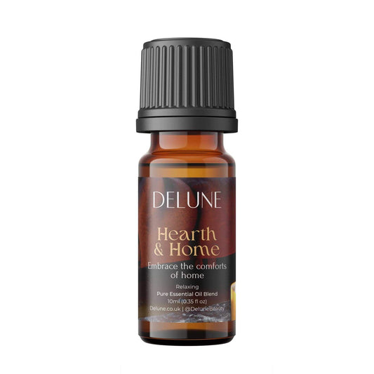 Hearth & Home essential oil blend bottle featuring comforting scents like cinnamon, clove, orange, and cedarwood for relaxation.