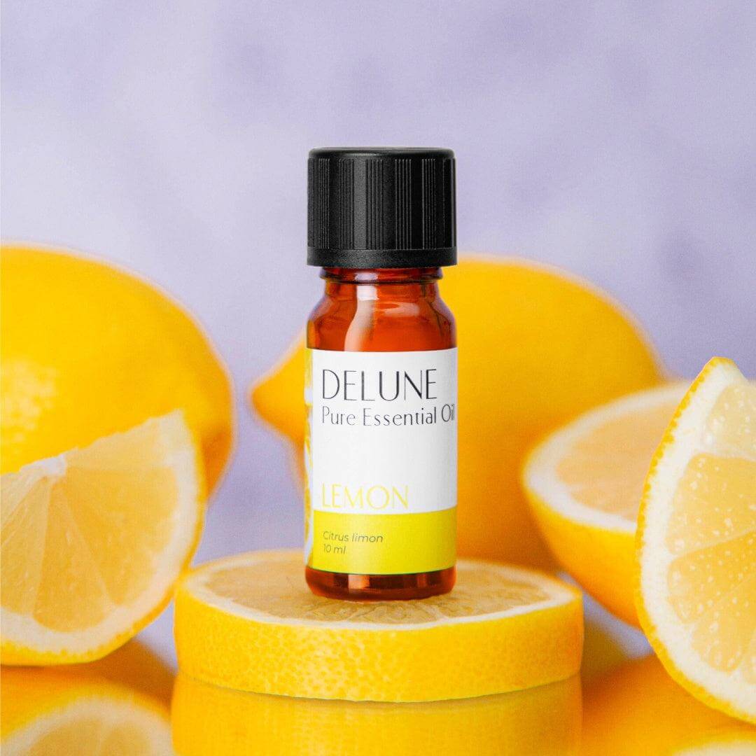 Lemon Pure Essential Oil bottle surrounded by fresh lemon slices, highlighting its bright, citrus scent and energizing properties.