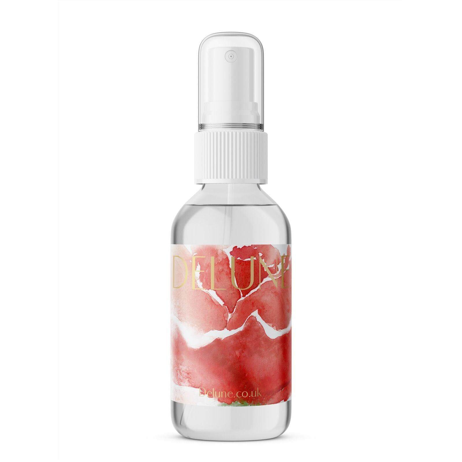 Rose Hydrosol Face Mist bottle with a red floral design, capturing the essence of rose petals for radiant, fragrant skin.