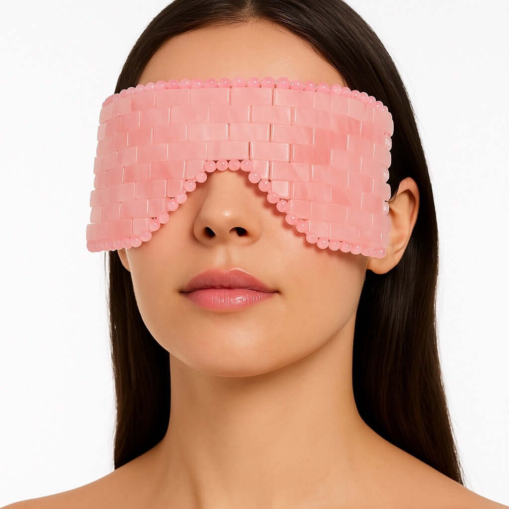 Woman wearing Rose Quartz Eye Mask for skincare relaxation, crafted from hand-polished stone, promoting self-love and wellness.