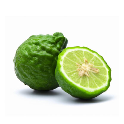 Fresh whole and sliced bergamot fruit with vibrant green rind and juicy interior on white background.