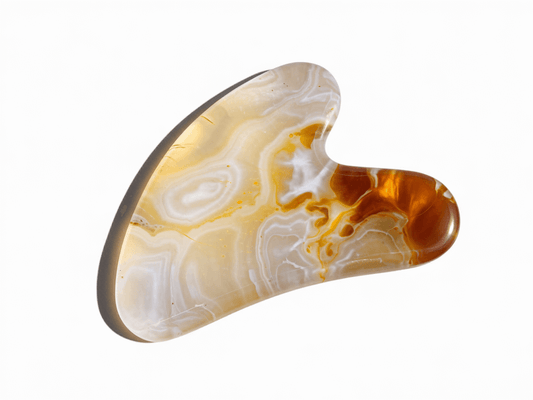 Citrine Gua Sha tool for skincare, enhancing circulation and glow, crafted from vibrant citrine stone for energy and revitalization.
