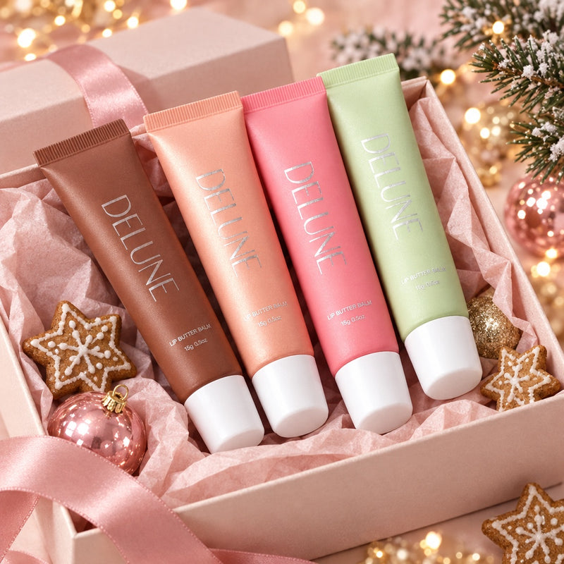 Lip Butter Balm in four shades in a pink Christmas gift box with gingerbread stars