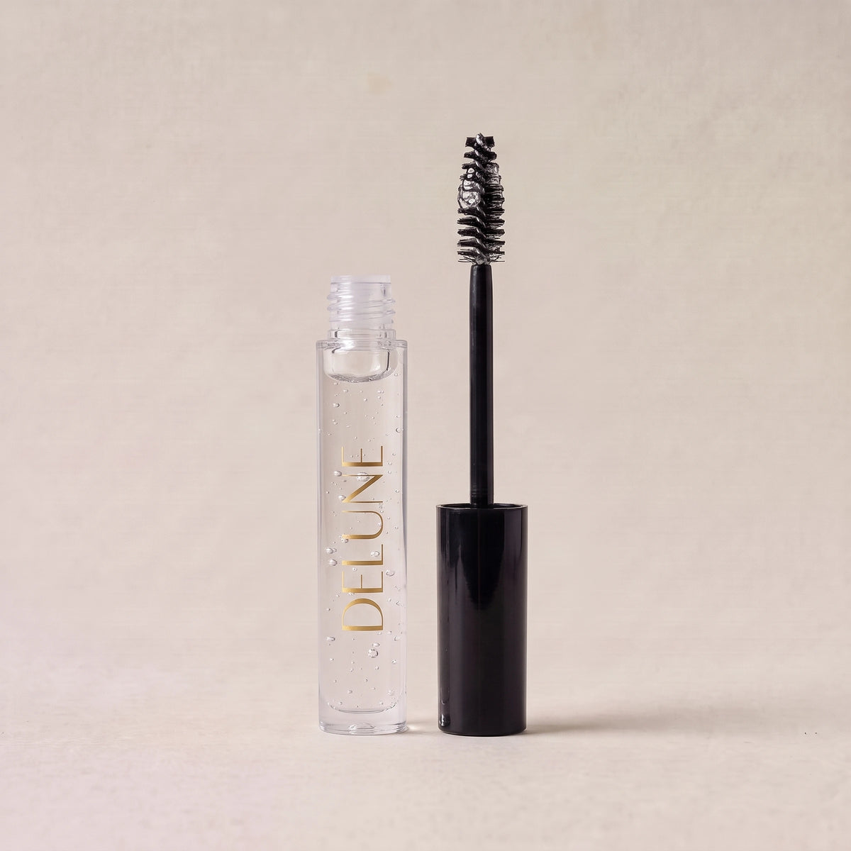 Delune Dubai Clear Brow Sculpt Gel, open with spoolie wand