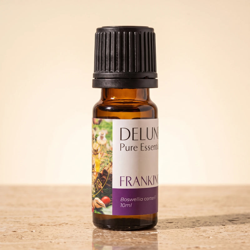 Delune Frankincense (Boswellia Carterii) Pure Essential Oil, 10ml amber glass bottle on warm travertine stone