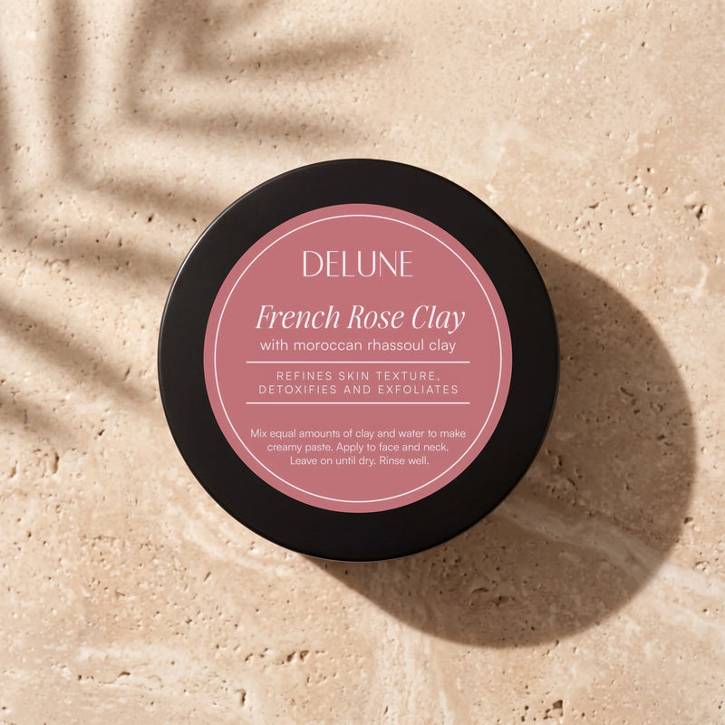 Clay face mask UAE – Delune Dubai French Rose Clay Mask jar from above on warm travertine in soft window light