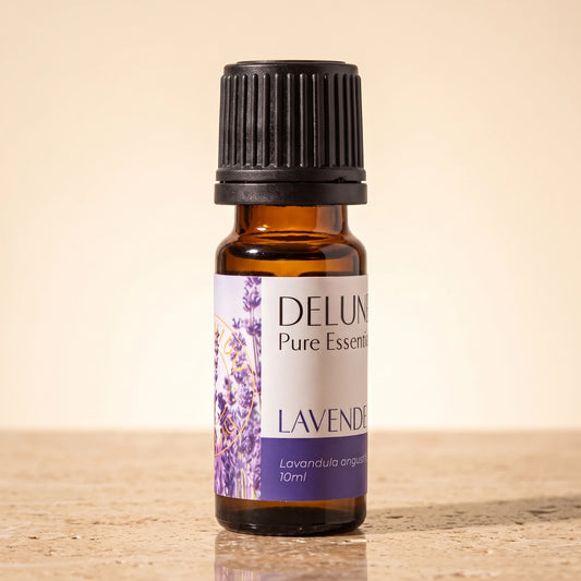 Delune Lavender (French) Pure Essential Oil, 10ml amber glass bottle on warm travertine stone