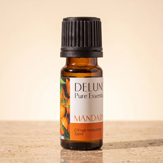 Mandarin essential oil UAE – Delune Dubai Mandarin Pure Essential Oil, 10ml amber glass bottle on warm travertine stone