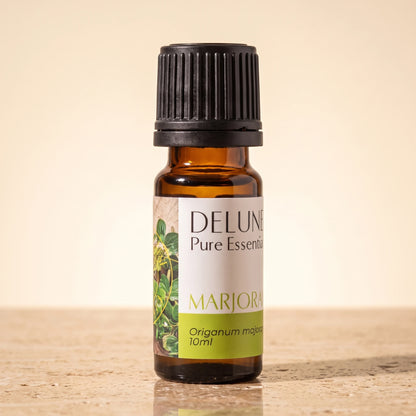 Marjoram essential oil UAE – Delune Dubai Marjoram Pure Essential Oil, 10ml amber glass bottle on warm travertine stone