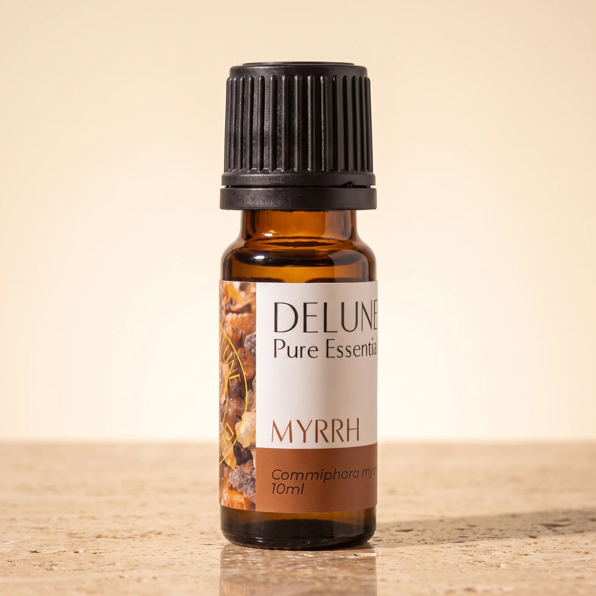 Myrrh essential oil UAE – Delune Dubai Myrrh Pure Essential Oil, 10ml amber glass bottle on warm travertine stone