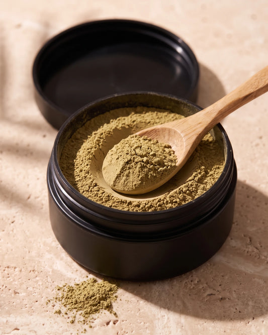 Clay face mask UAE – Open jar of Delune Dubai Nontronite Glacial Clay showing the soft dry olive clay powder with a wooden