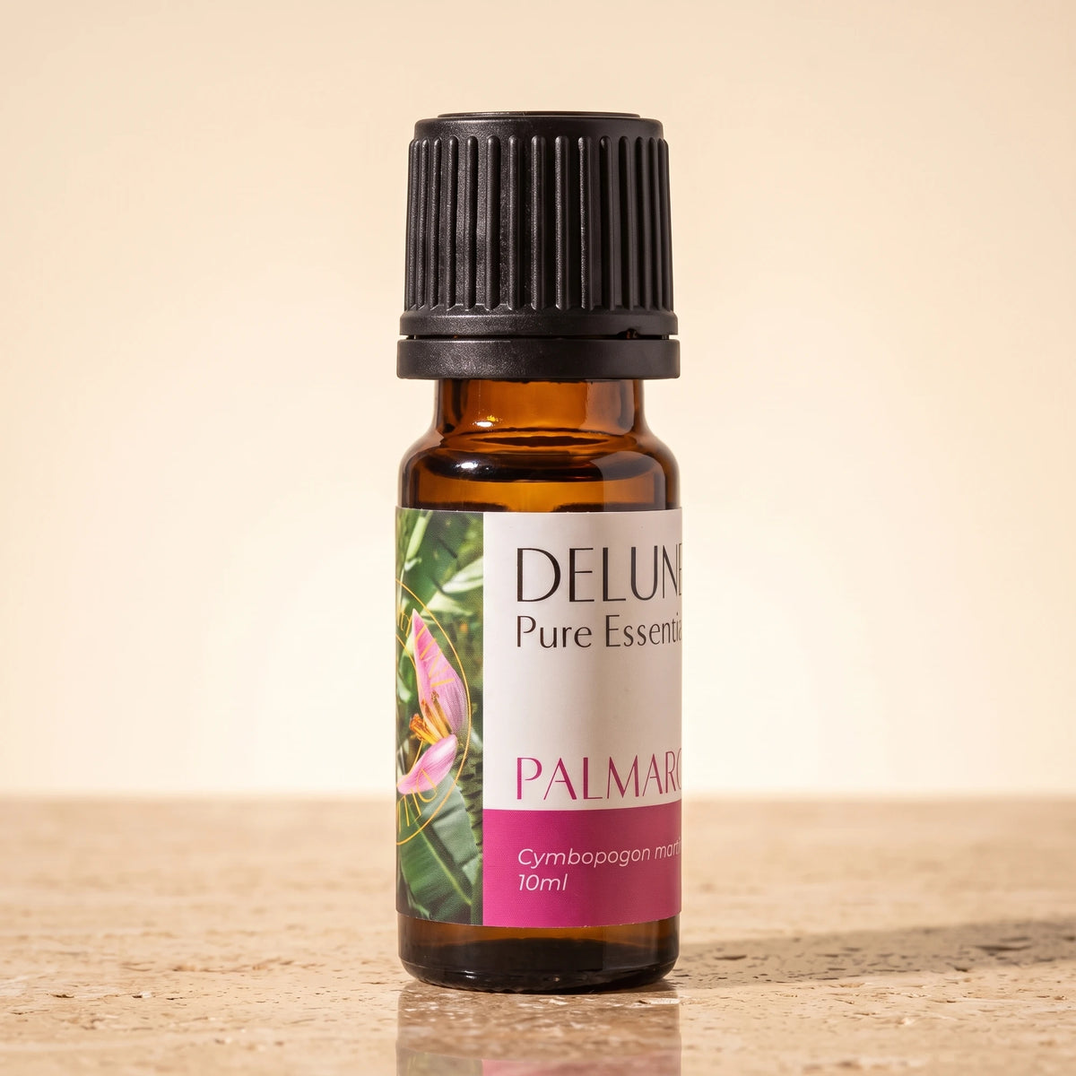 Palma Rosa essential oil UAE – Delune Dubai Palma Rosa Pure Essential Oil, 10ml amber glass bottle on warm travertine stone