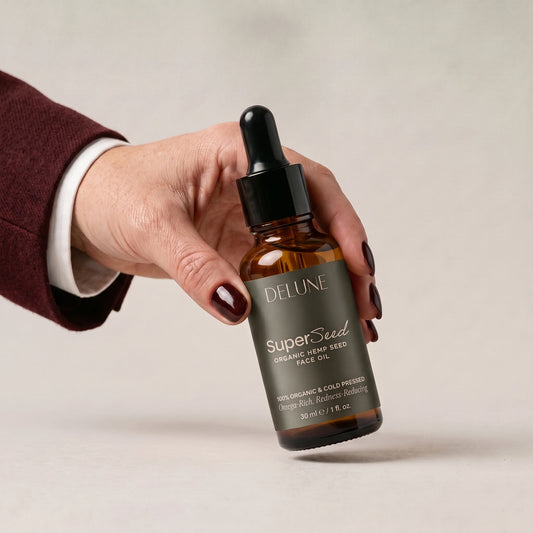Face oil UAE – Hand picking up Delune Dubai Super Seed Hemp Seed Face Oil