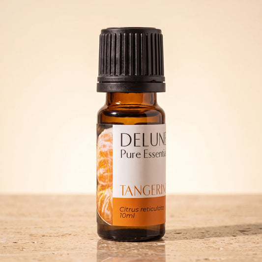 Tangerine essential oil UAE – Delune Dubai Tangerine Pure Essential Oil, 10ml amber glass bottle on warm travertine stone