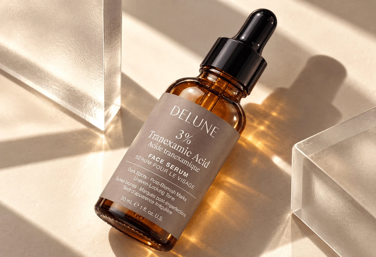 Delune 3% Tranexamic Acid face serum between glass blocks