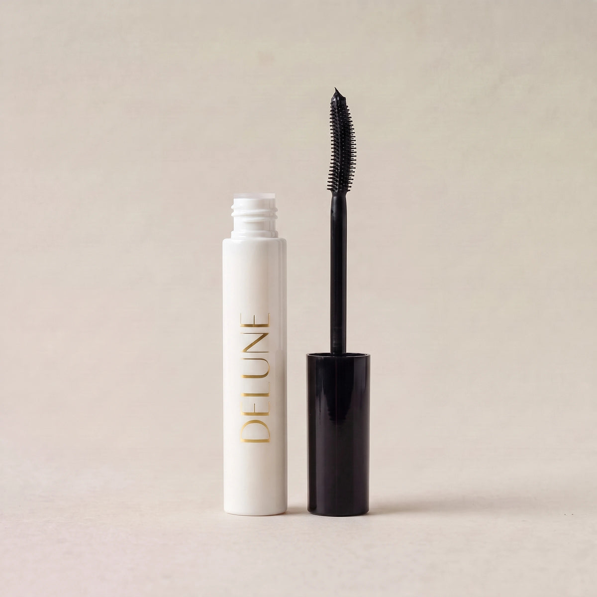 Delune Dubai Tubing Mascara, open with curved brush wand