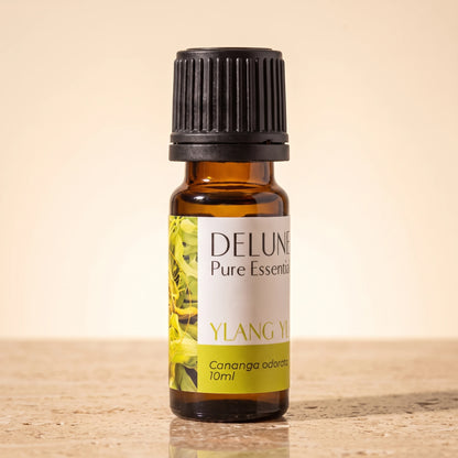 Ylang Ylang essential oil UAE – Delune Dubai Ylang Ylang Pure Essential Oil, 10ml amber glass bottle on warm travertine stone