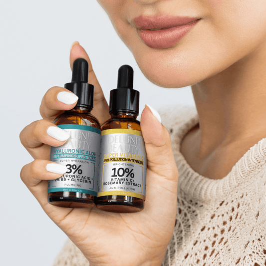 Woman holding Delune Hyaluronic Acid and Vitamin C Serum Duo, featuring 3% hyaluronic acid and 10% vitamin C for radiant skin.