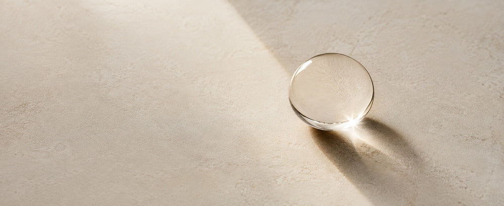 Editorial Pure Squalane considered minimal oil detail on ivory stone