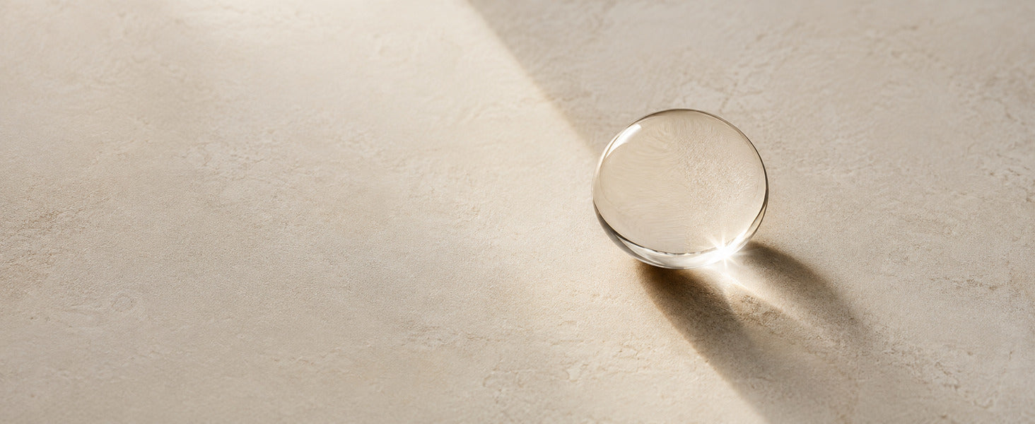 Editorial Pure Squalane considered minimal oil detail on ivory stone