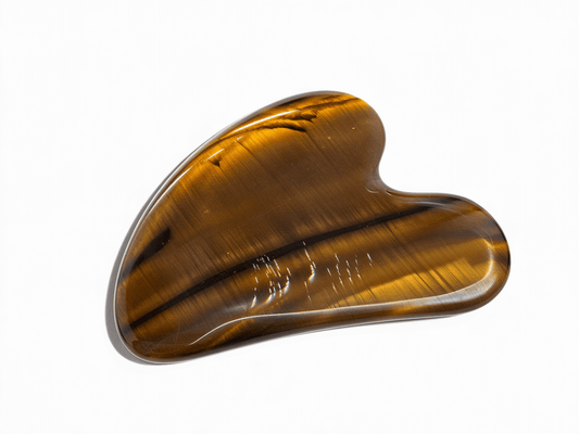 Tiger's Eye Gua Sha Tool for revitalizing skin, enhancing vitality, and improving elasticity with grounding energy.