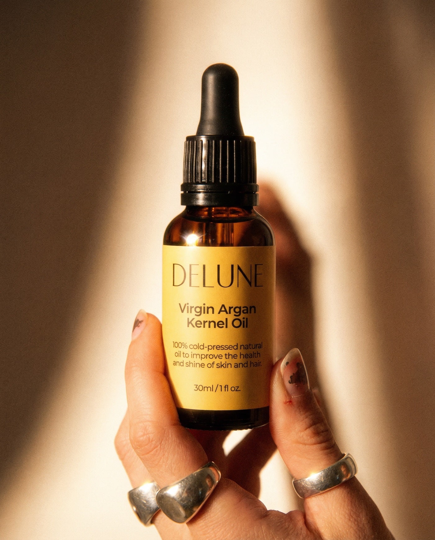 Delune Virgin Argan Kernel Oil bottle for skin and hair health, 100% cold-pressed, rich in vitamins, carotene, omega 6. 30ml size.