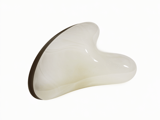 White Jade Gua Sha Tool for soothing skin and reducing inflammation, ideal for sensitive skin care.